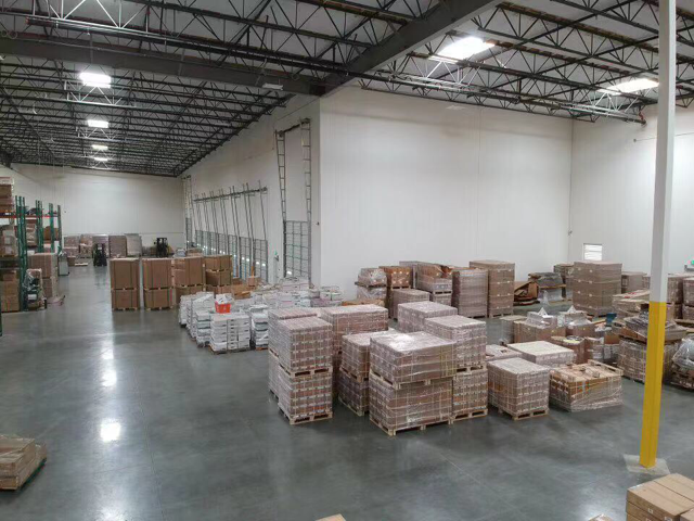 Logistics professional reviewing shipment status